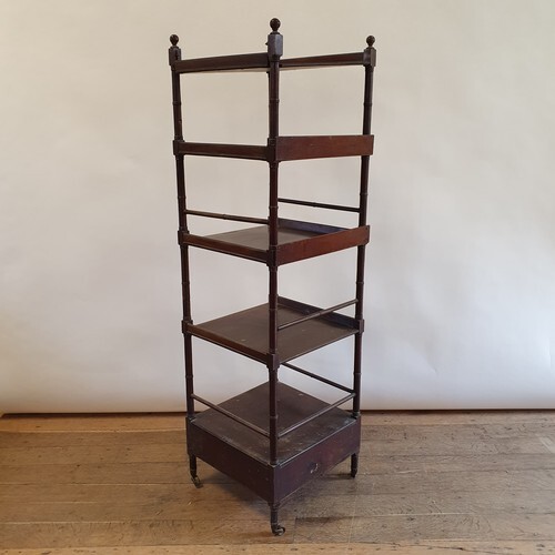 A 19th century mahogany four tier whatnot, with a drawer to ...