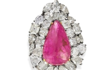 A BURMA NO HEAT RUBY AND DIAMOND BROOCH / PENDANT set with a pear shaped fancy cut ruby of 20.91 ...