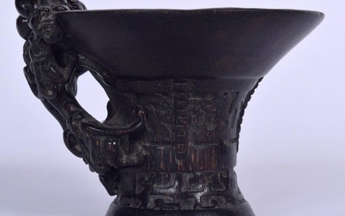 A CHINESE CARVED BAMBOO LIBATION CUP, formed with