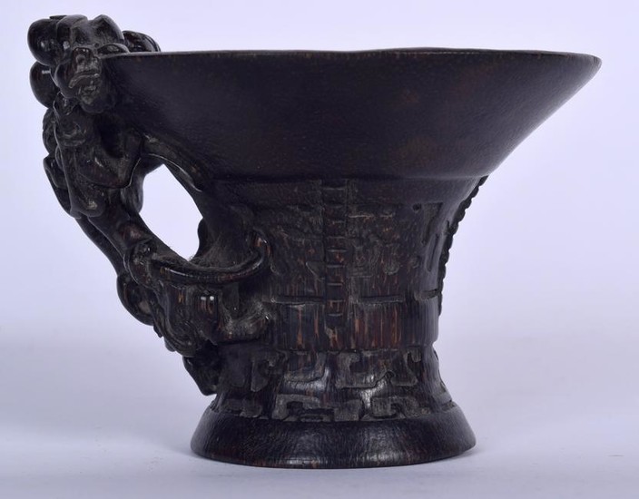 A CHINESE CARVED BAMBOO LIBATION CUP, formed with