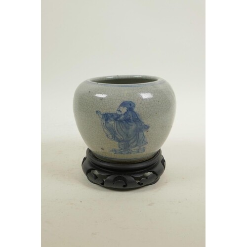 A Chinese blue and white crackle ware pot decorated with imm...
