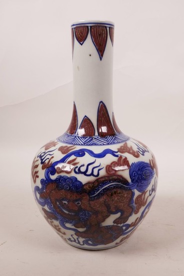 A Chinese blue, white and red porcelain bottle vase with kyl...