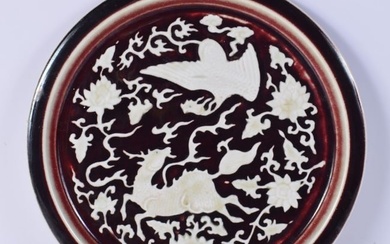 A Chinese porcelain dish decorated with animals and Phoenix in relief 30.5 cm