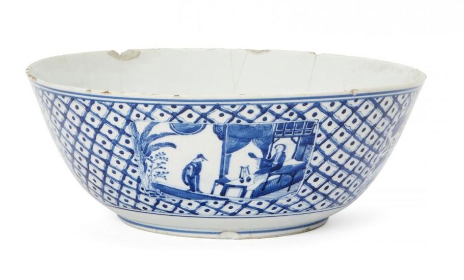A Chinese porcelain punch bowl, 18th century, painted in underglaze...