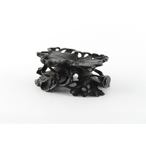 A Chinese zitan stand, 19th century, carved as lotus, 4.3ins...