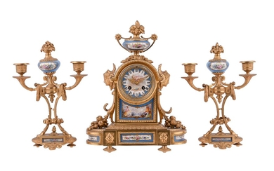 A French gilt metal and Sevres style porcelain mantel clock garniture
