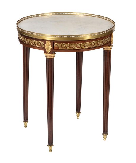 A French mahogany and gilt metal mounted gueridon table in Louis XVI style