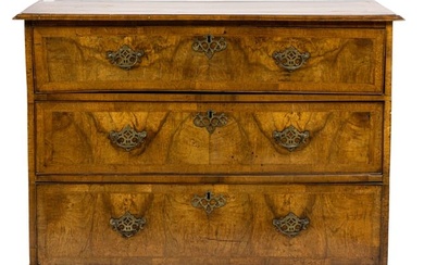 A George II walnut chest of drawers circa 1760, the string and crossbanded case with three drawers