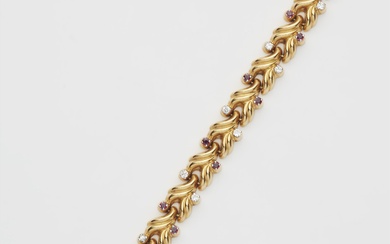 A German 18k gold repoussé gold diamond and ruby bracelet.