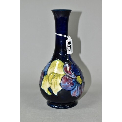 A MOORCROFT POTTERY BULBOUS SHAPED VASE DECORATED IN THE CLE...