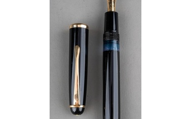 A Montblanc black fountain pen with gilt fittings, the 14c g...