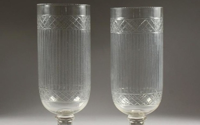 A PAIR OF CUT GLASS STORM LAMPS, on square stepped