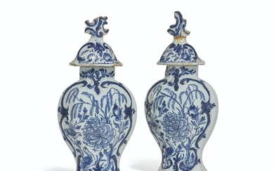 A PAIR OF DUTCH DELFT VASES AND COVERS