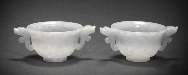 A PAIR OF JADEITE TWO-HANDLED WINE CUPS