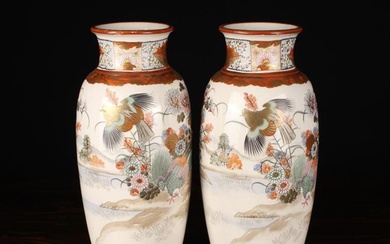 A Pair of Ovoid Kutani Vases decorated with a continuous frieze of birds and flowers on river bank