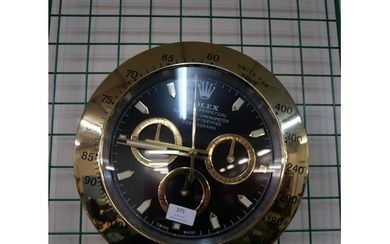 A Rolex style dealers display wall clock