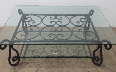 A WROUGHT IRON BASED COFFEE TABLE