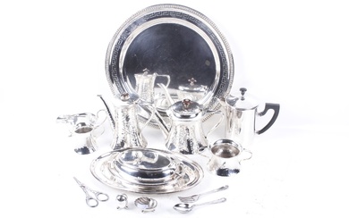 A collection of silver-plate including a beaded round tray with an engraved Greek-key band.