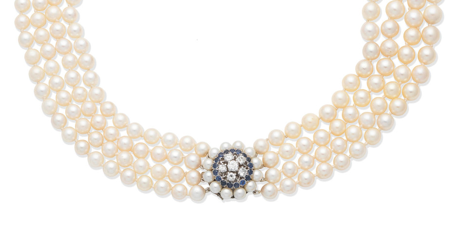 A cultured pearl necklace with a sapphire and diamond clasp