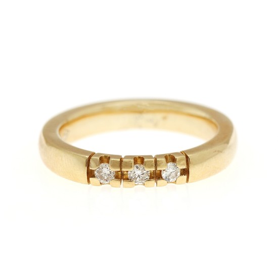 A diamond eternity ring set with three brilliant-cut diamonds totalling app. 0.12 ct., mounted in 18k gold. Size 54. Weight app. 6.5 g.