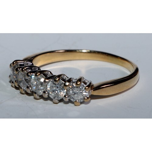 A diamond quintet line ring, linear set with five conforming...