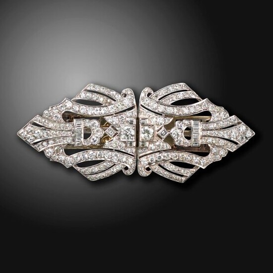 A diamond-set double clip brooch, set with graduated old circular,...