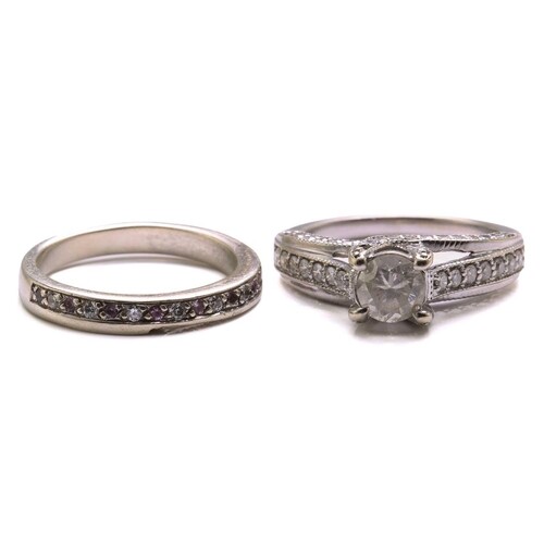 A diamond trellis engagement ring and a fitted enhancer guar...