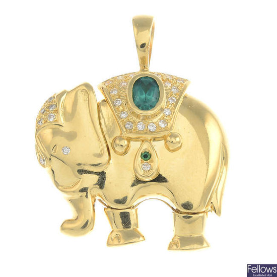 A green paste and diamond elephant pendant.