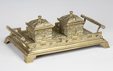 A late Victorian Gothic Revival cast brass inkstand, the two lidded inkwells flanked by spiral twist