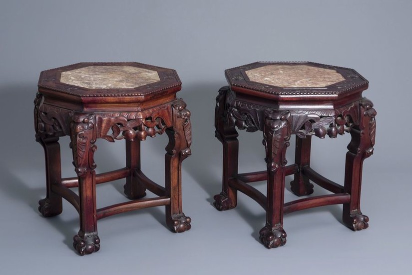A pair of Chinese carved wood stands with...
