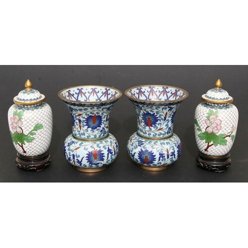 A pair of Chinese cloisonne vases decorated with flowers on ...