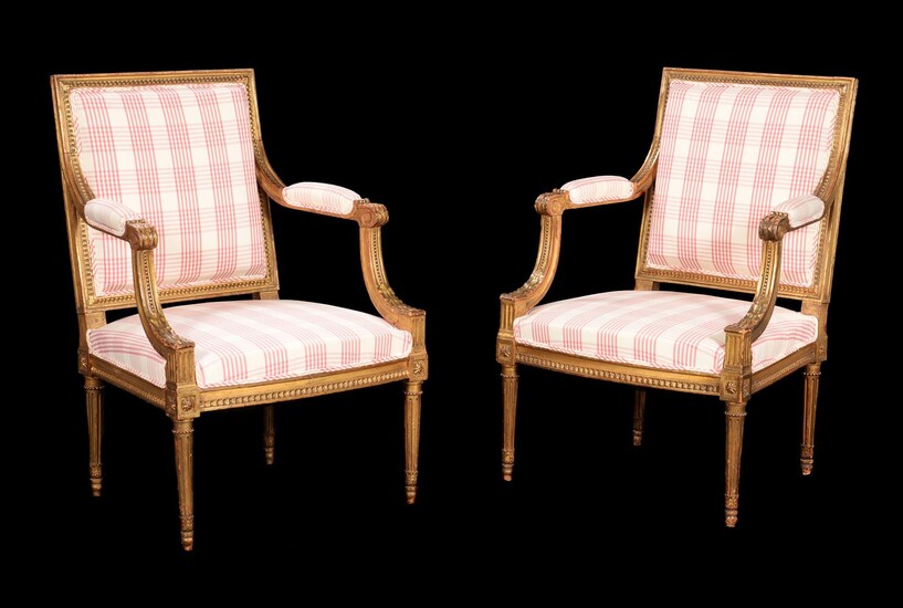 A pair of French giltwood armchairs