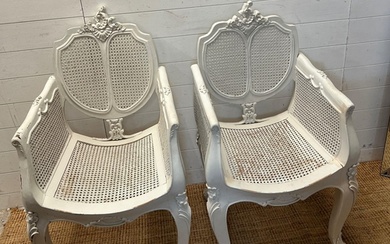 A pair of French painted Bergère arm chairs