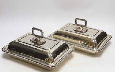 A pair of George V silver rectangular entrée dishes with cov...
