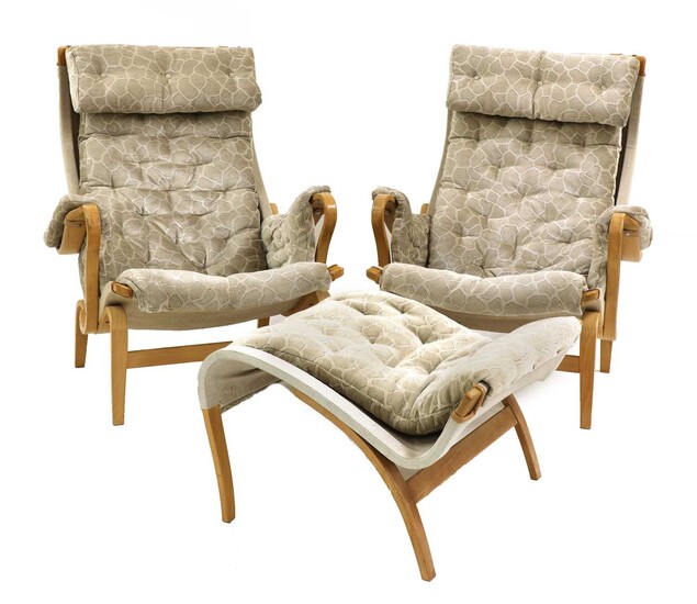 A pair of 'Pernilla 69' lounge chairs and an ottoman