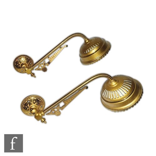 A pair of late 19th Century Aesthetic brass wall lights in t...