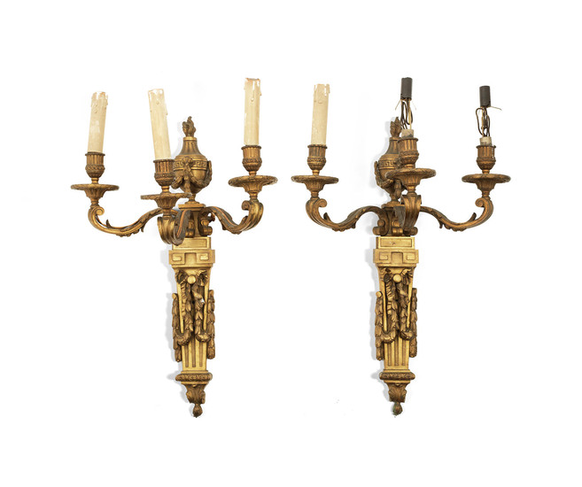 A pair of late 19th/early 20th century French gilt bronze three light wall appliques