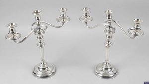 A pair of mid-20th century silver mounted candelabra.