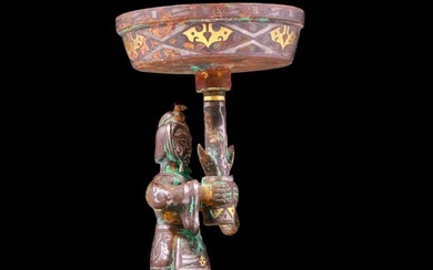 A precious bronze inlaid gold and silver figure candlestick