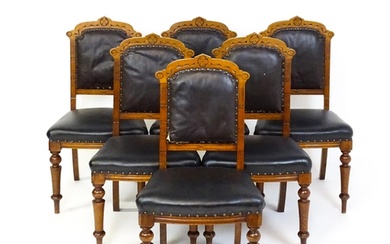 A set of six late 19thC oak Gothic style dining chairs with ...