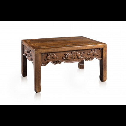 A side table decorated with auspicious fruits carved to...