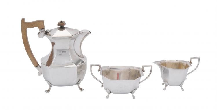 A silver canted rectangular hot water pot, cream jug and sugar basin by Viners