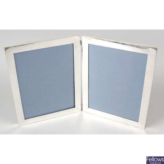 A silver mounted double hinged photograph frame.