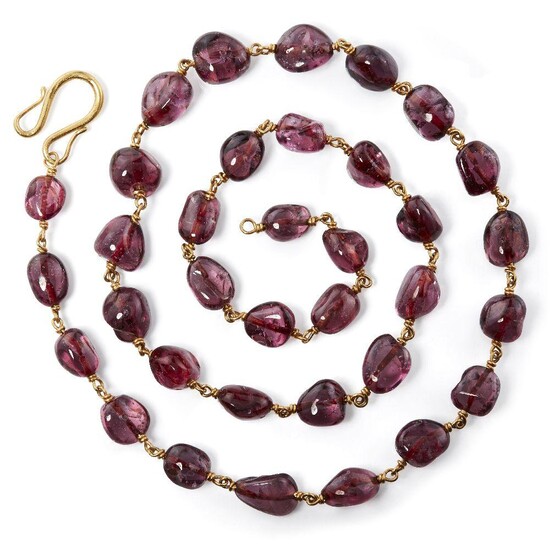 A spinel necklace, India, with thirty-seven polished spinels, each weighing between 12-15 carats, with gold wire links and gold hook clasp, 72cm. long, weight 93.4 grams (including the 23.5 carat gold wire) Mughal emperors have had, for centuries...