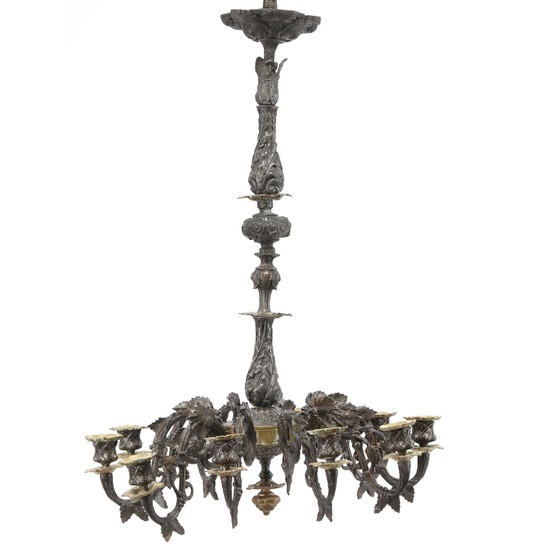 A ten-light patinated metal chandelier. Late 19th century. H. 75 cm. Diam. 50 cm.