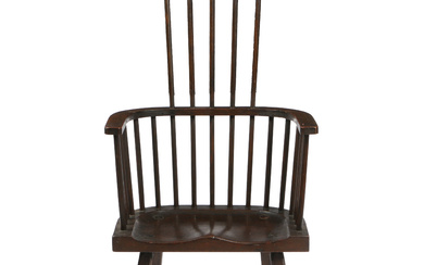 AN 18TH CENTURY STYLE ENGLISH COMB BACK WINDSOR ARMCHAIR.