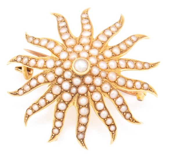 AN ANTIQUE 15CT GOLD STARBURST PEARL BROOCH; set with seed pearls, with Birmingham import hallmarks for 1906, N.H, with hook for ext...