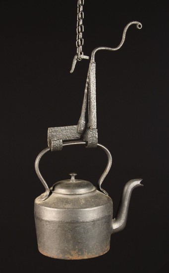 An 18th Century Wrought Iron Kettle Tilt and a 19th Century 4 Quart Cast Iron Kettle. The kettle mar
