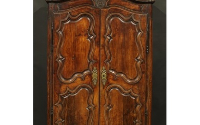 An 18th century French Provincial chestnut armoire, chapeau ...