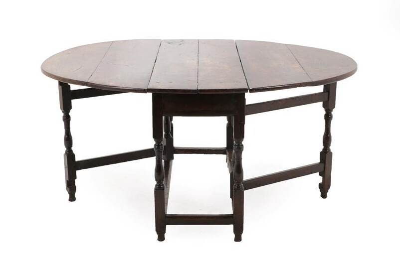 An Early 18th Century Six-Seater Oak Gateleg Table, with two...